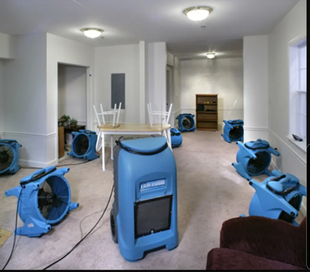Air movers and dehumidifier setup for Water Damage Restoration in Le Ray